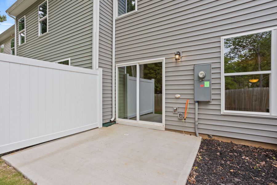 Exterior details and patio area of a home in East Main Townes, Spartanburg (Image 4). Exterior details and patio area of a home in East Main Townes, Spartanburg (Image 4).