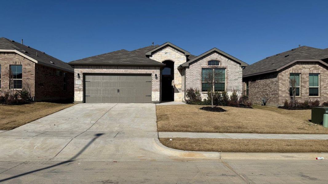 Front exterior of a new home in Legado, Cleburne, TX, highlighting curb appeal (Image 1). Front exterior of a new home in Legado, Cleburne, TX, highlighting curb appeal (Image 1).