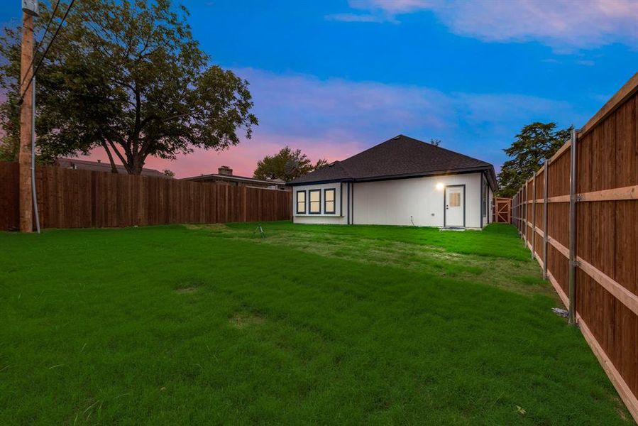 View of yard at dusk