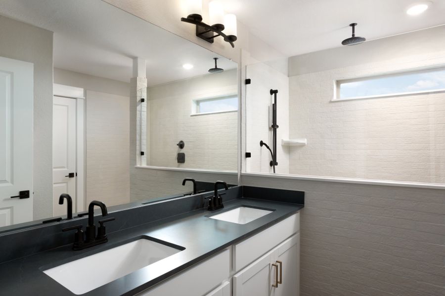 Owner's bathroom with double vanity and tile floor