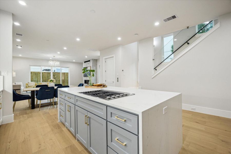 Kitchen - has an island with gas range. Kitchen - has an island with gas range.