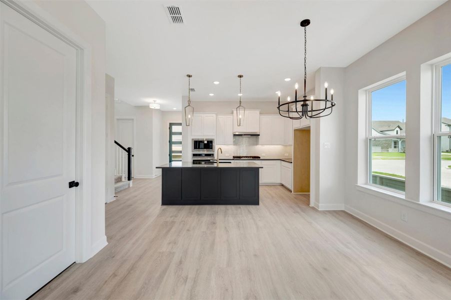 Furnished interior view inside a new home in Pomona - Grove Row Collection, Manvel (Image 3).
