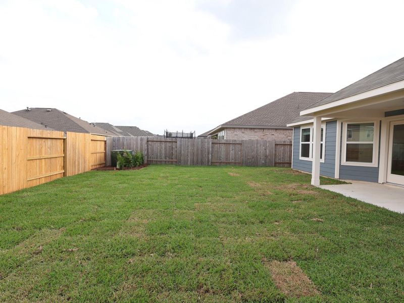 Exterior details and patio area of a home in Magnolia Ridge, Magnolia (Image 16). Exterior details and patio area of a home in Magnolia Ridge, Magnolia (Image 16).
