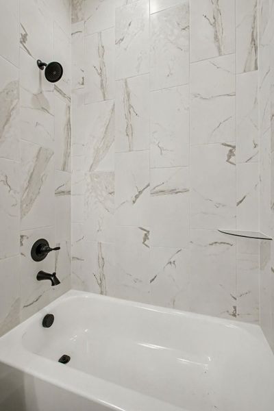 Full bathroom with shower / tub combination