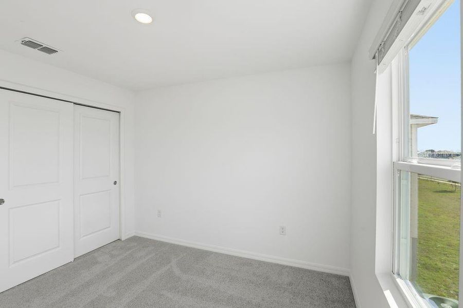 Spacious, unfurnished interior of a new home in Waterstone, Groveland (Image 33).