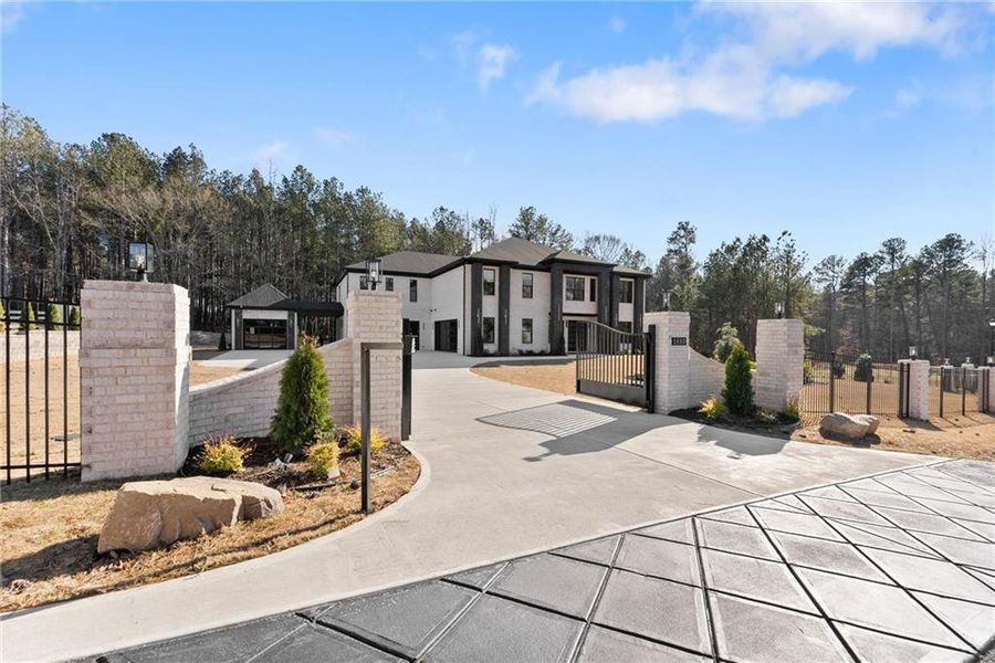 Front exterior of a new home in , Hoschton, GA, highlighting curb appeal (Image 30).