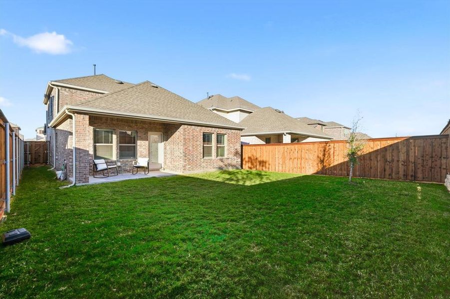 Exterior details and patio area of a home in Spiritas Ranch, Little Elm (Image 22). Exterior details and patio area of a home in Spiritas Ranch, Little Elm (Image 22).