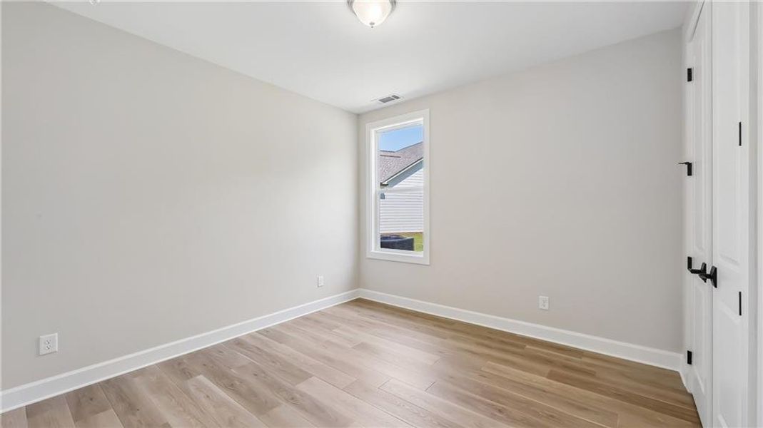 Spacious, unfurnished interior of a new home in Cresswind Georgia at Twin Lakes, Hoschton (Image 44).