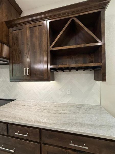 Beverage center with storage and wine glass shelves