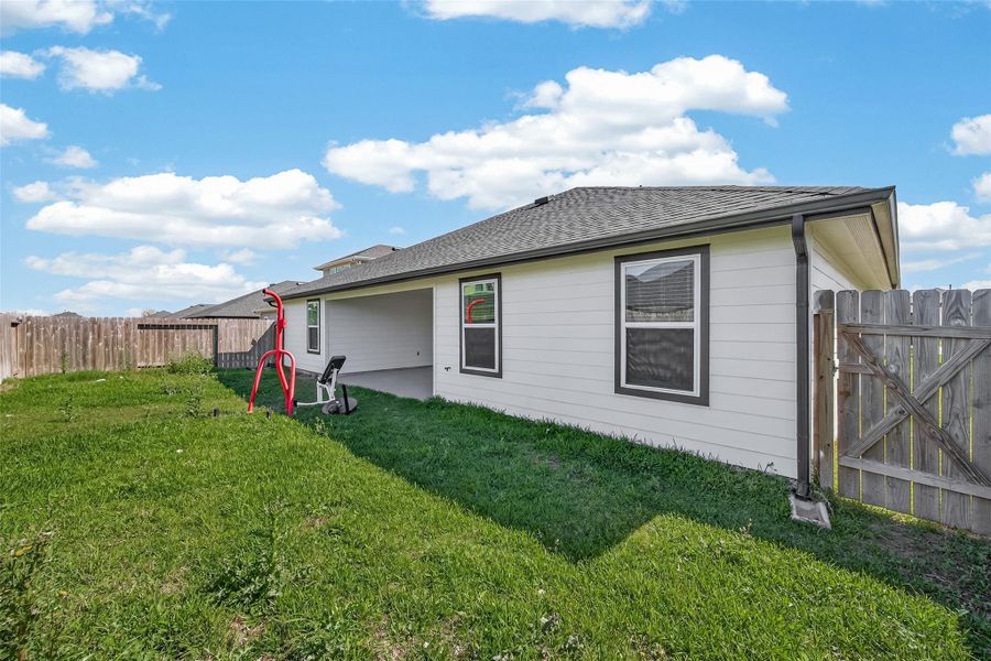 Exterior details and patio area of a home in Windstone on the Prairie, Richmond (Image 29).