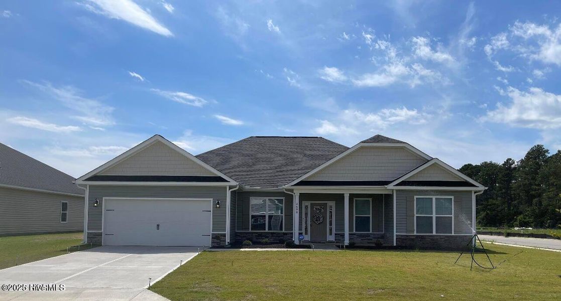 Front exterior of a new home in Windfield, Grimesland, NC, highlighting curb appeal (Image 1).