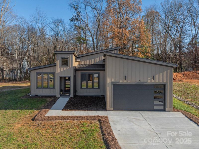 Front exterior of a new home in , Asheville, NC, highlighting curb appeal (Image 1). Front exterior of a new home in , Asheville, NC, highlighting curb appeal (Image 1).