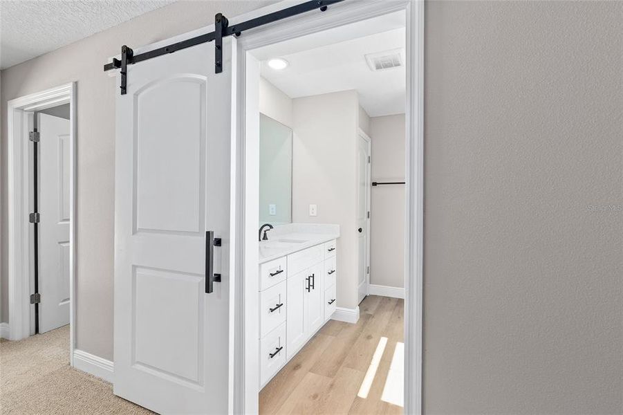 The Barn door leads you to the Primary ensuite.