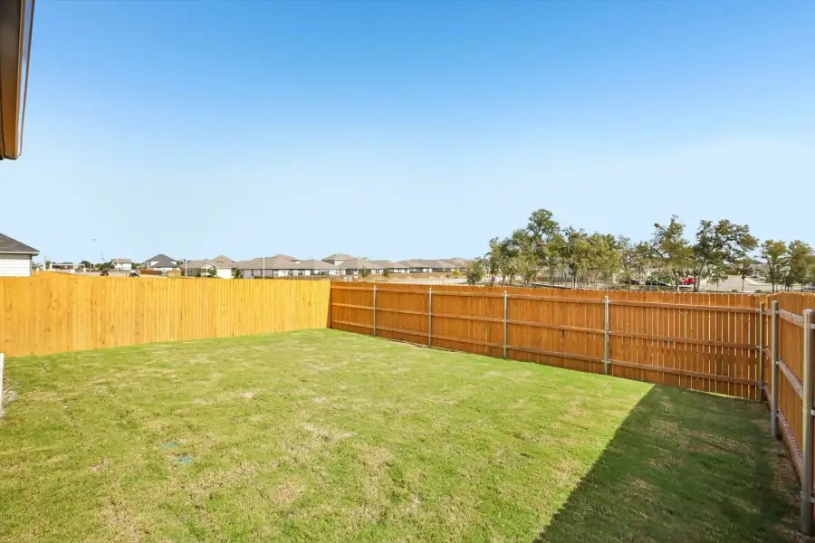 Exterior details and patio area of a home in Trinity Ranch, Elgin (Image 21).