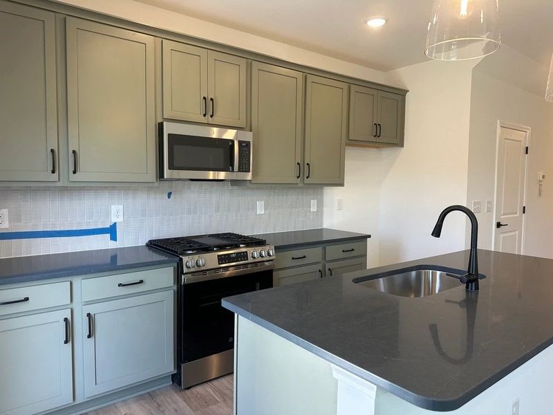 Kitchen featuring the AW Collection® Rosemary - Matte black, light wood, and garden-inspired style.