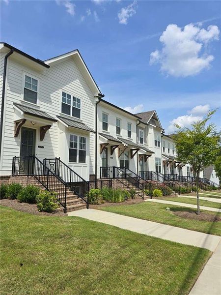 Front exterior of a new home in , Suwanee, GA, highlighting curb appeal (Image 26).