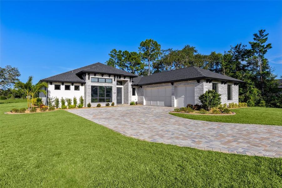 Front exterior of a new home in , New Smyrna Beach, FL, highlighting curb appeal (Image 22). Front exterior of a new home in , New Smyrna Beach, FL, highlighting curb appeal (Image 22).