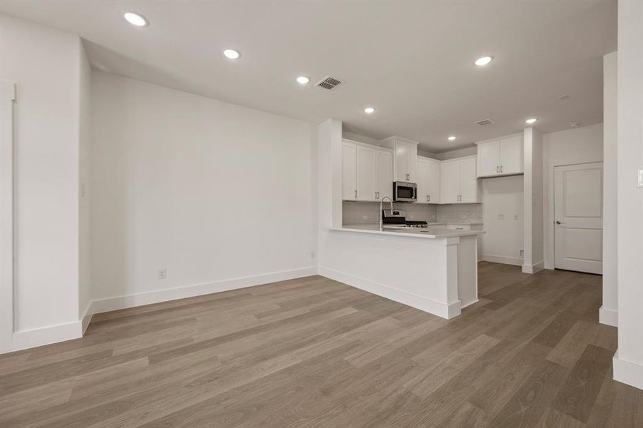 Your new kitchen peninsula offers a great place for a quick bite or homework station.