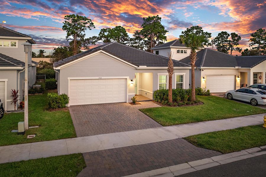 Front exterior of a new home in Banyan Bay, Stuart, FL, highlighting curb appeal (Image 23).