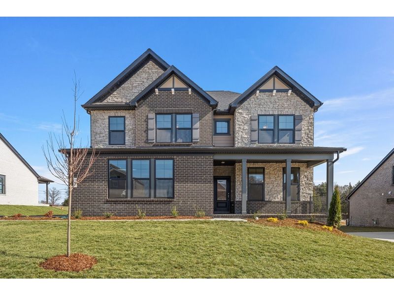 Front exterior of a new home in Benders Cove, Mount Juliet, TN, highlighting curb appeal (Image 1). Front exterior of a new home in Benders Cove, Mount Juliet, TN, highlighting curb appeal (Image 1).