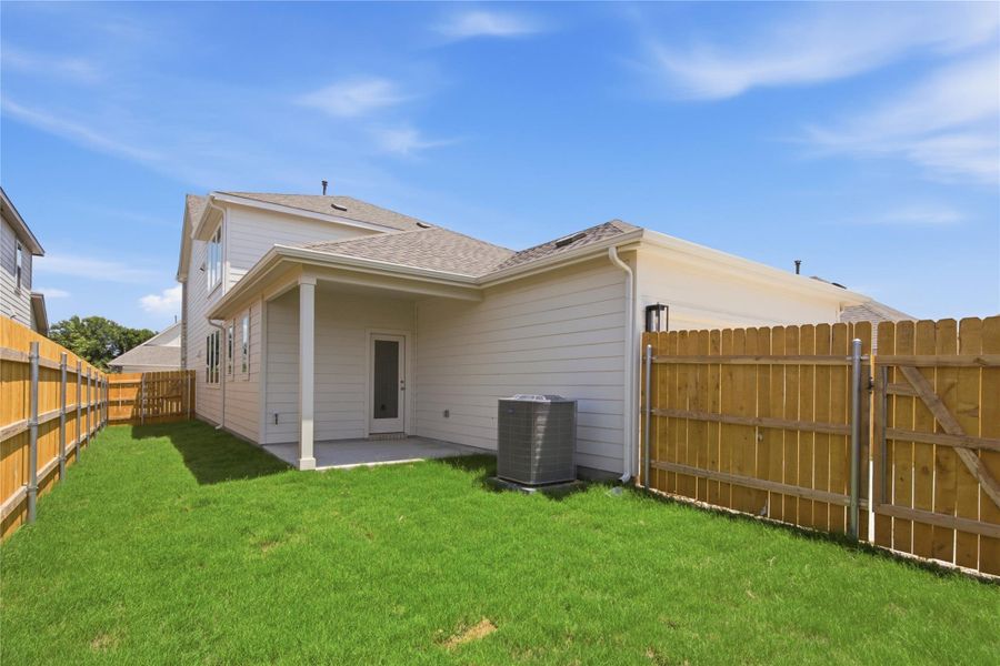 Exterior details and patio area of a home in Creeks Crossing, Elgin (Image 18). Exterior details and patio area of a home in Creeks Crossing, Elgin (Image 18).