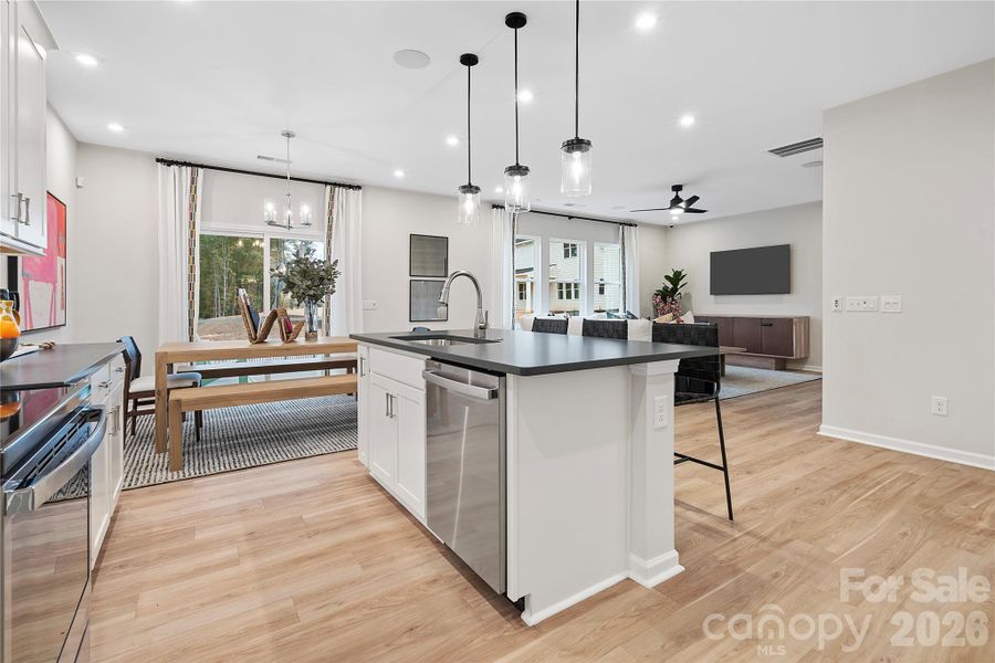 Large central island for casual dining perfectly paired with barstools.