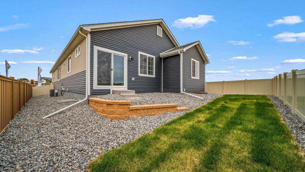 Exterior details and patio area of a home in Thompson River Ranch, Johnstown (Image 3).
