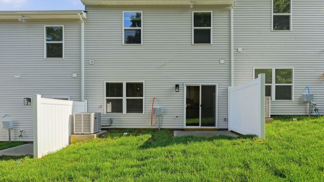Exterior details and patio area of a home in Macon Townhomes, Seymour (Image 3). Exterior details and patio area of a home in Macon Townhomes, Seymour (Image 3).