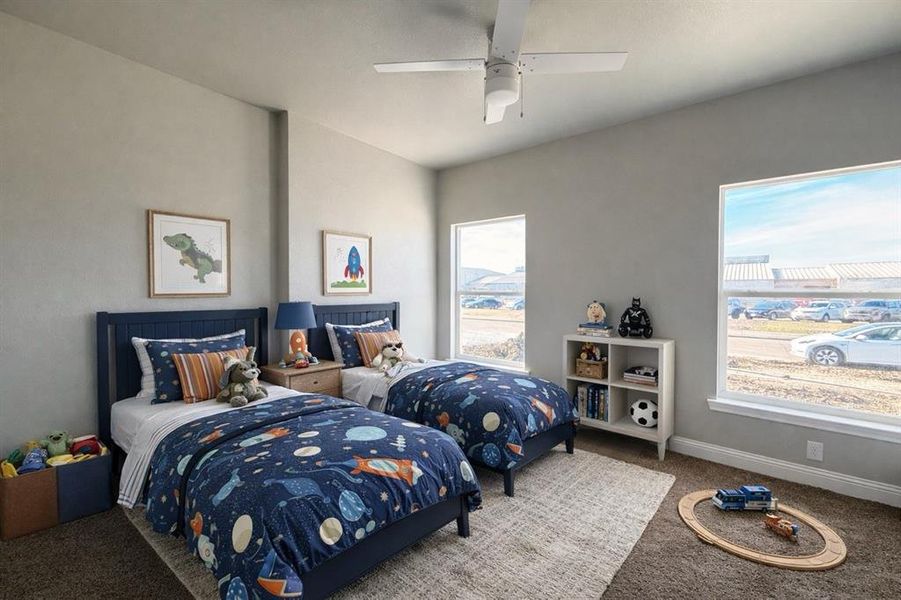 Carpeted bedroom featuring ceiling fan and baseboards Carpeted bedroom featuring ceiling fan and baseboards