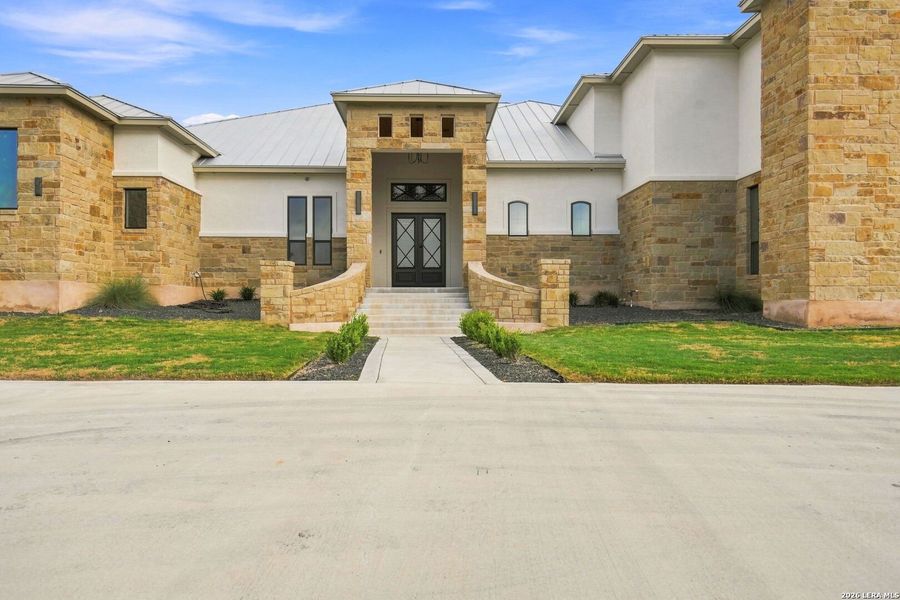 Front exterior of a new home in , Canyon Lake, TX, highlighting curb appeal (Image 2). Front exterior of a new home in , Canyon Lake, TX, highlighting curb appeal (Image 2).