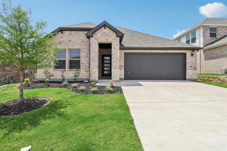 Front exterior of a new home in Westmoor, Sherman, TX, highlighting curb appeal (Image 18).