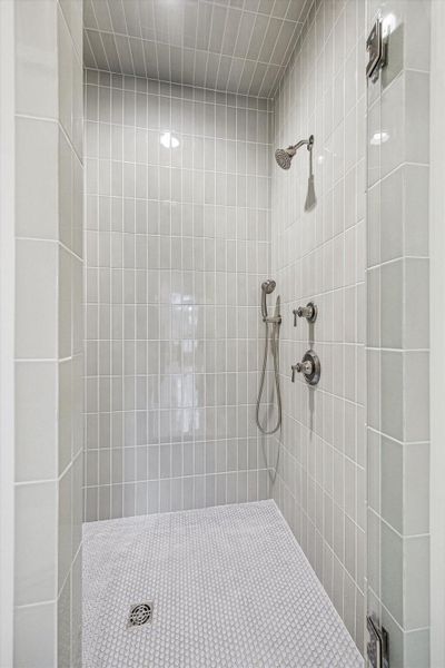 Custom features in downstairs shower, including designer tile, shower head plus handheld fixtures! Custom features in downstairs shower, including designer tile, shower head plus handheld fixtures!