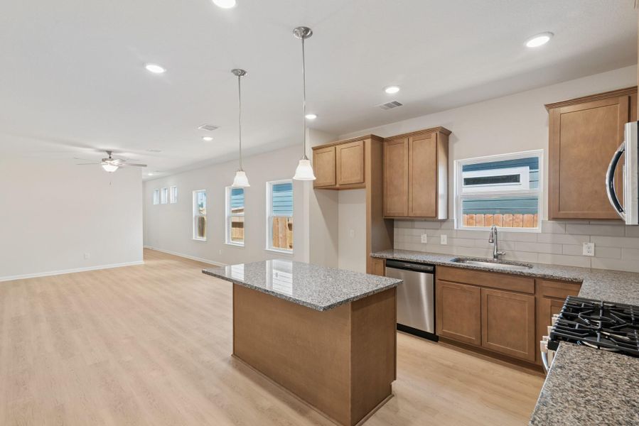 The Mockingbird II- Kitchen into the Family Room The Mockingbird II- Kitchen into the Family Room