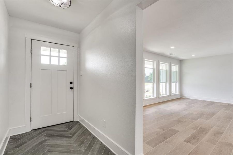 Foyer entrance with parquet floors.... Be prepared to be AMAZED As you enter this home.