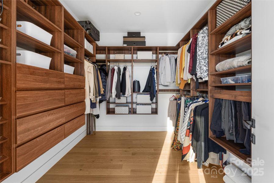 1 of 2 walk-in custom closets in the primary suite.