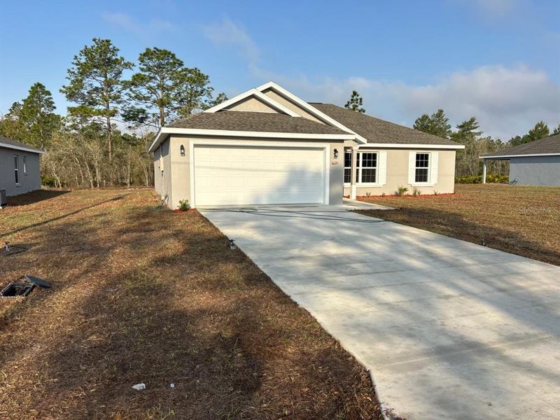 Front exterior of a new home in , Dunnellon, FL, highlighting curb appeal (Image 2). Front exterior of a new home in , Dunnellon, FL, highlighting curb appeal (Image 2).