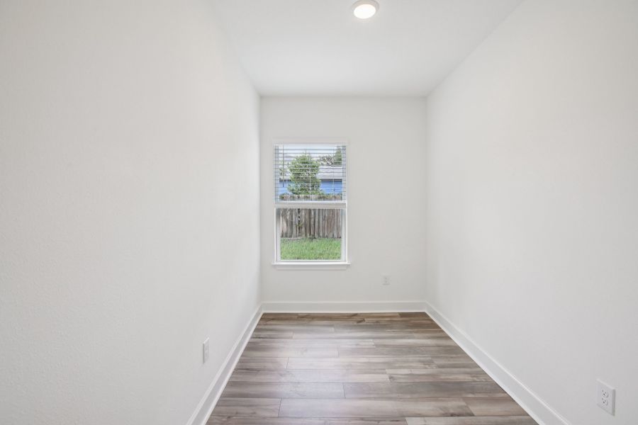 Exquisite simplicity with premium wood flooring and ample natural light, located in Spring Hill.