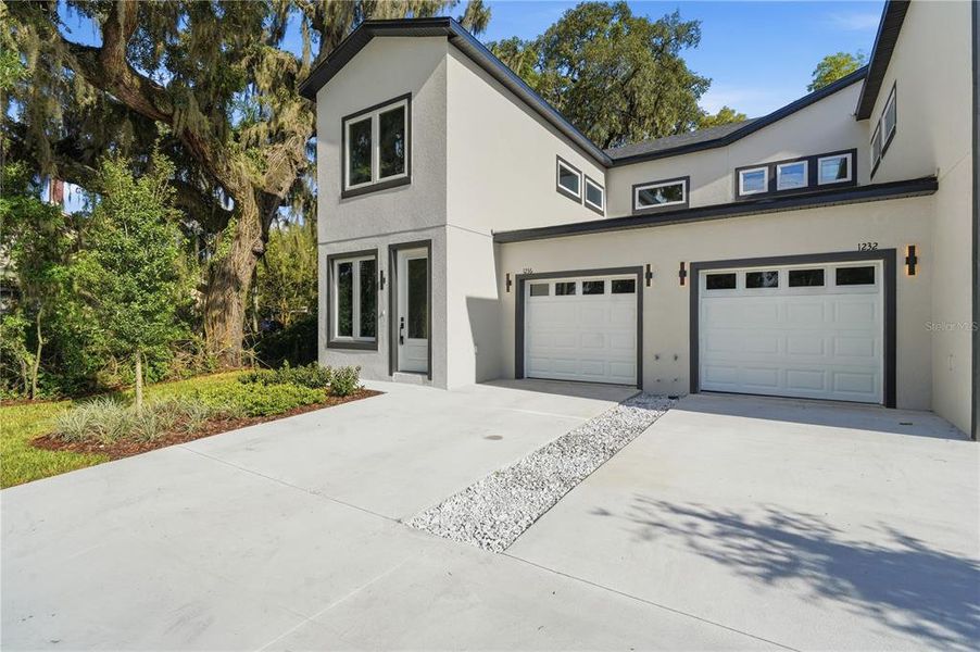 Front exterior of a new home in , Orlando, FL, highlighting curb appeal (Image 19). Front exterior of a new home in , Orlando, FL, highlighting curb appeal (Image 19).