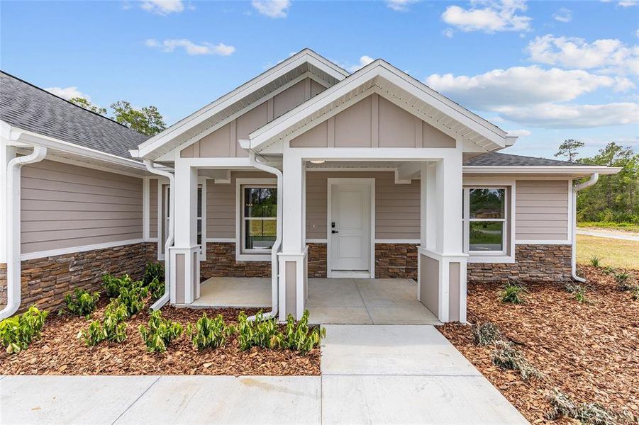 Front exterior of a new home in , Dunnellon, FL, highlighting curb appeal (Image 24). Front exterior of a new home in , Dunnellon, FL, highlighting curb appeal (Image 24).