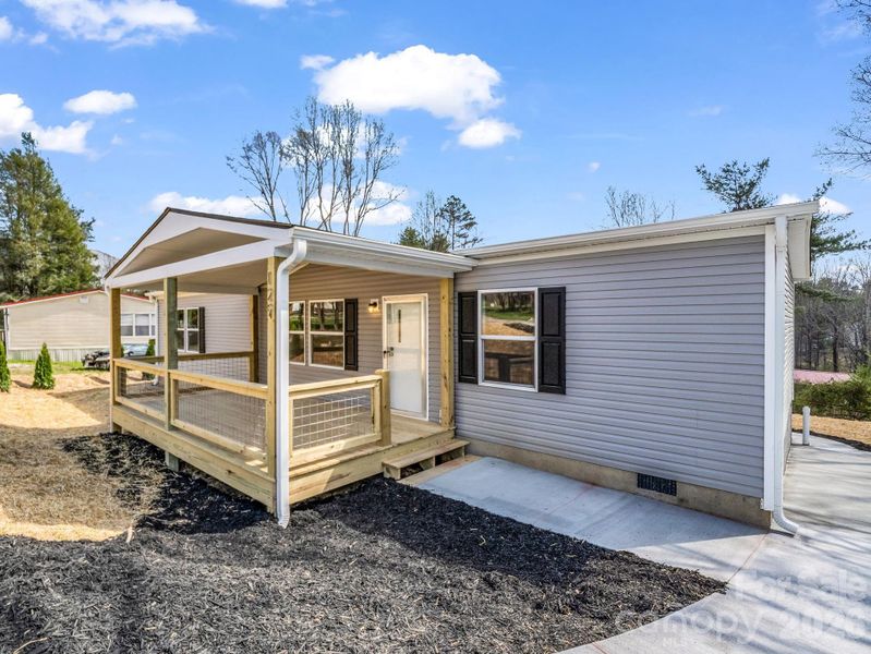 Exterior details and patio area of a home in , East Flat Rock (Image 15).