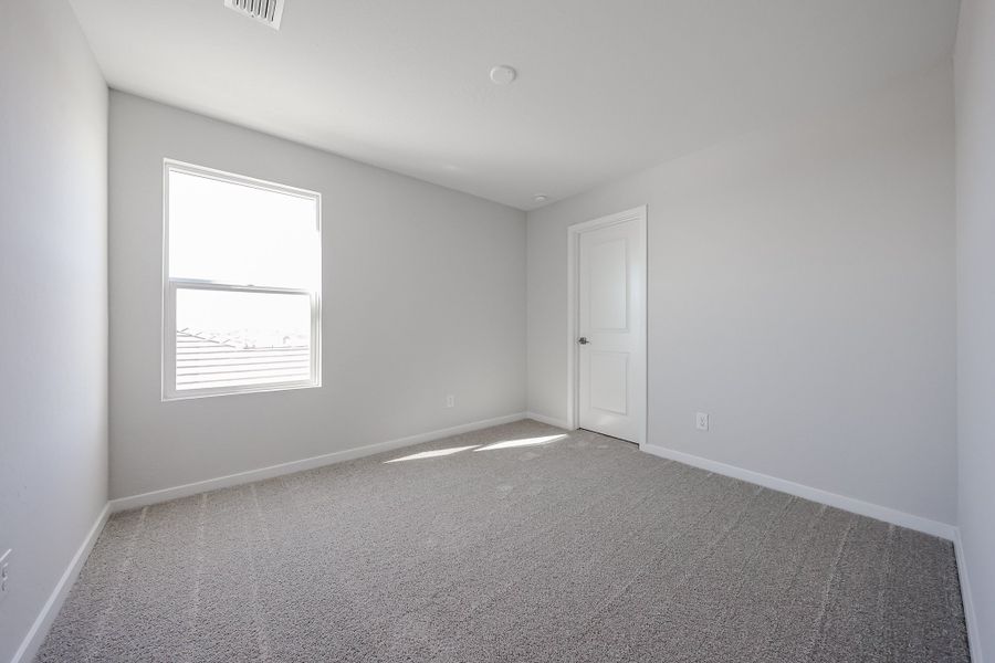 A room with a door and a window. A room with a door and a window.