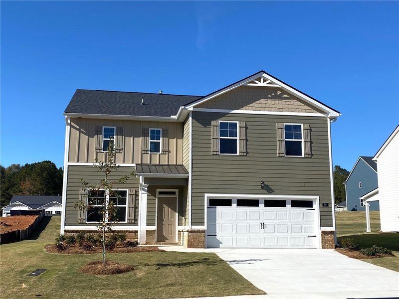 Front exterior of a new home in Preserve at Dove Creek, Statham, GA, highlighting curb appeal (Image 30).