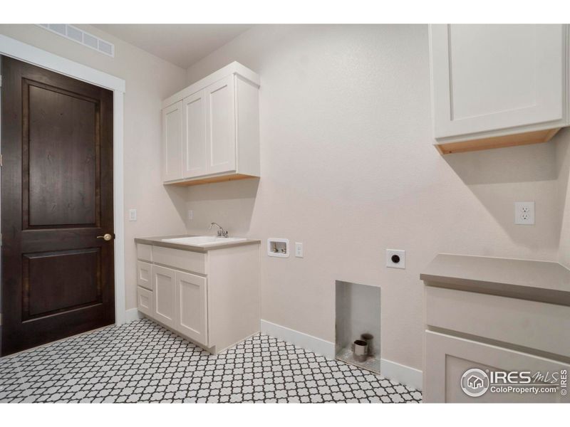 Spacious laundry room/mudroom.