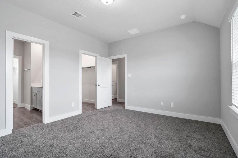 The private primary suite efficiently connects the sleeping area with the dedicated bathroom and generous closet storage, creating a functional and private sanctuary. The private primary suite efficiently connects the sleeping area with the dedicated bathroom and generous closet storage, creating a functional and private sanctuary.