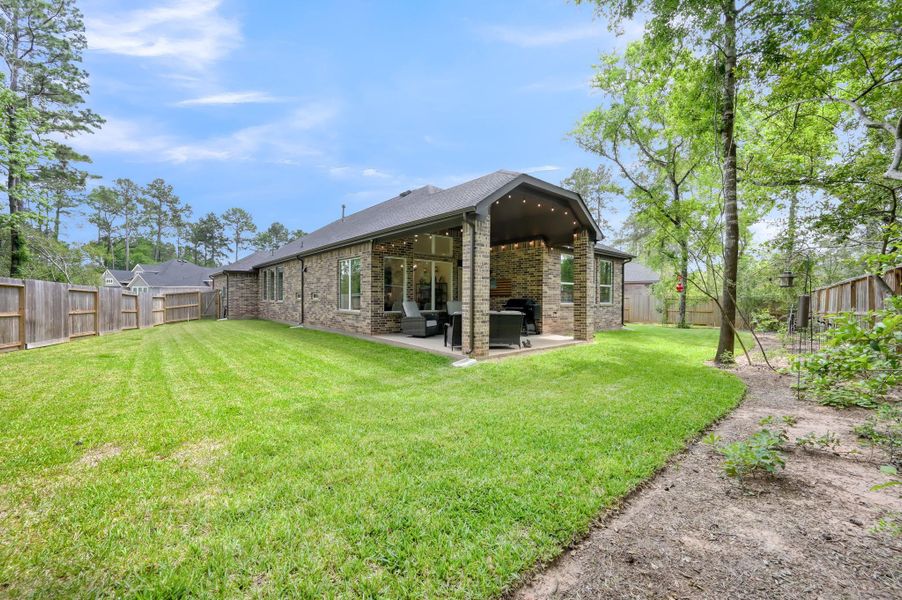 Exterior details and patio area of a home in The Woodlands Hills, Willis (Image 3).