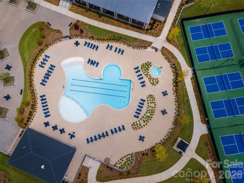 Aerial view pool and pickleball courts