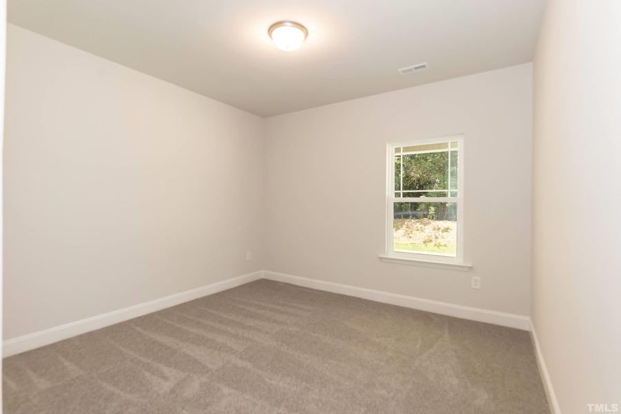 Representative unfurnished interior of a home built from the 1634 by Adams Homes in Parkland Place, Pace (Image 21).