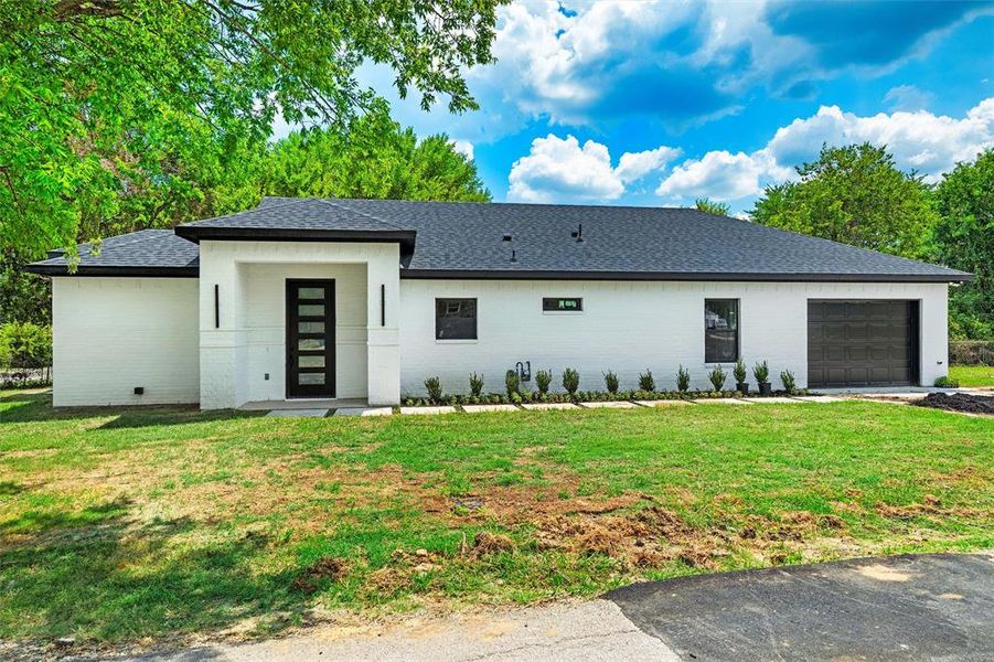 Front exterior of a new home in , Ennis, TX, highlighting curb appeal (Image 2). Front exterior of a new home in , Ennis, TX, highlighting curb appeal (Image 2).