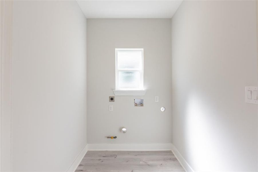 Utility room located upstairs.