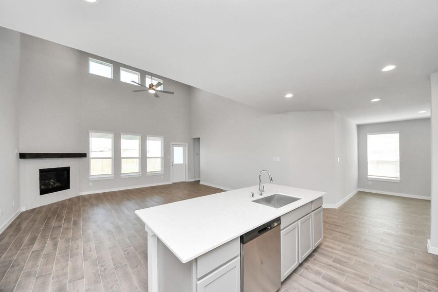 The open concept effortlessly connects the kitchen to the expansive family room, forming a perfect hub for gatherings. This seamless flow creates an inviting space where cooking and socializing come together harmoniously. The open concept effortlessly connects the kitchen to the expansive family room, forming a perfect hub for gatherings. This seamless flow creates an inviting space where cooking and socializing come together harmoniously.